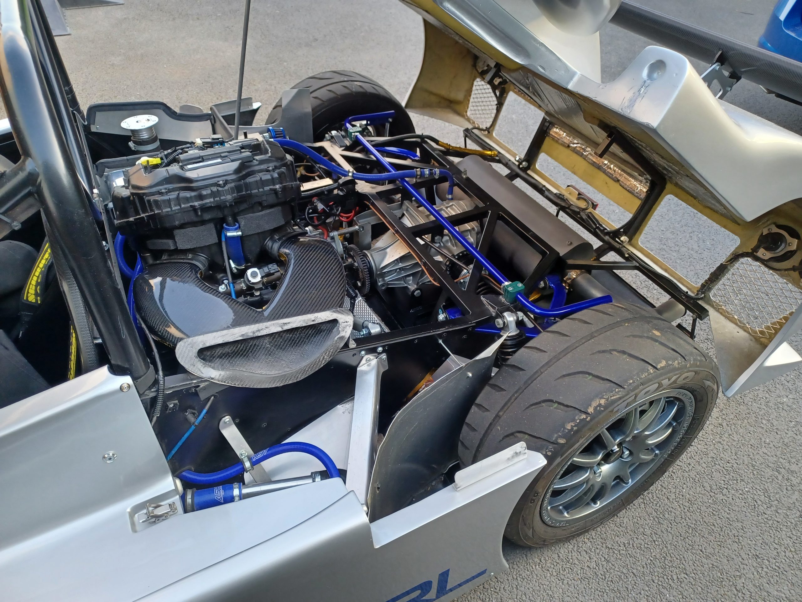 A close-up view of the motorcycle engine installed in the bike engine car, highlighting its compact and powerful features.